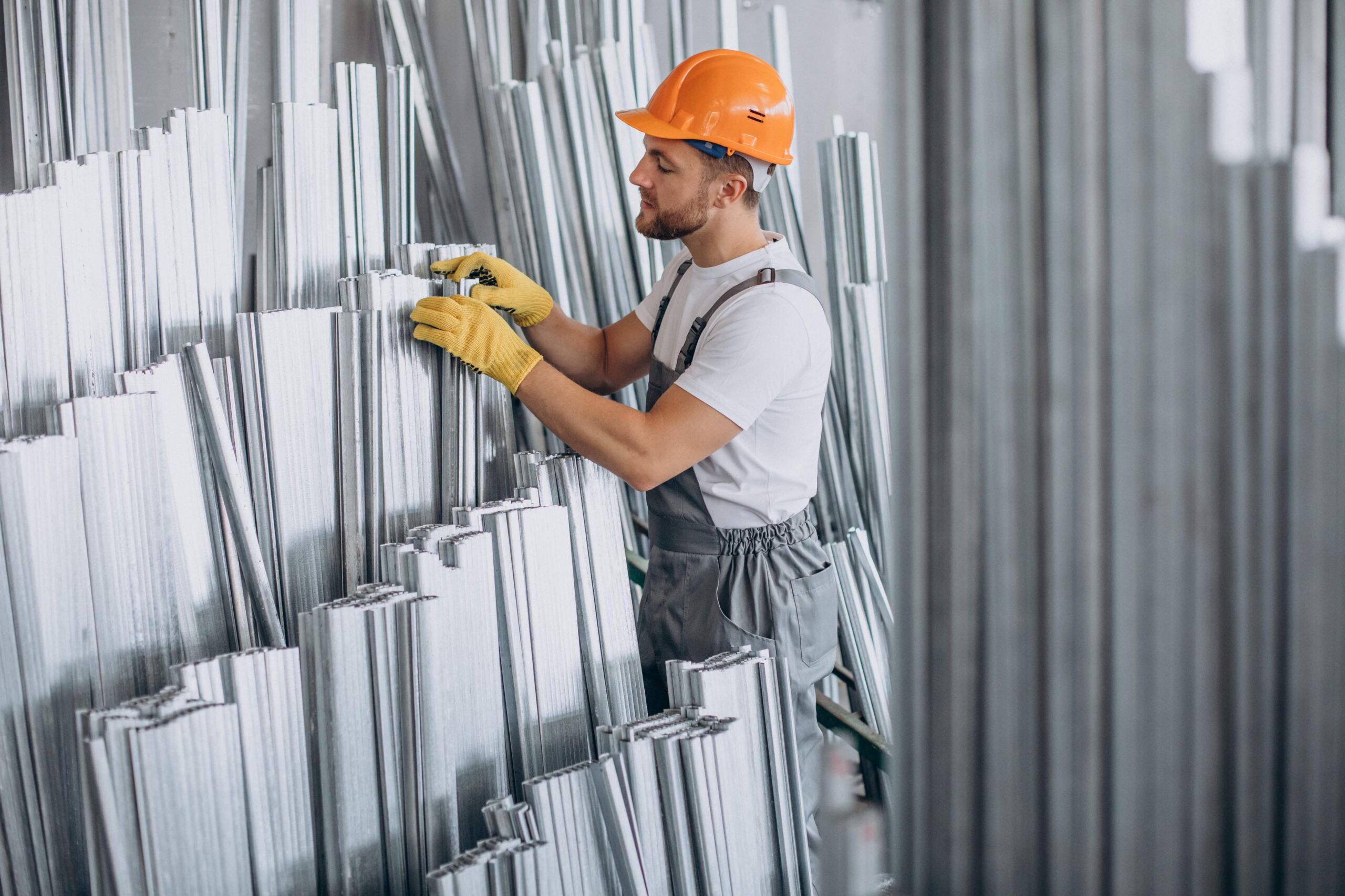 workman at store house in orange helmet